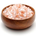 Himalaya salt in wooden bowl isolated on white background